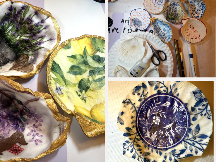 Kunstvoll bemalte Muschelschalen mit floralen Mustern, Goldrand und Bastelutensilien liegen auf einem hellen Tisch arrangiert.
