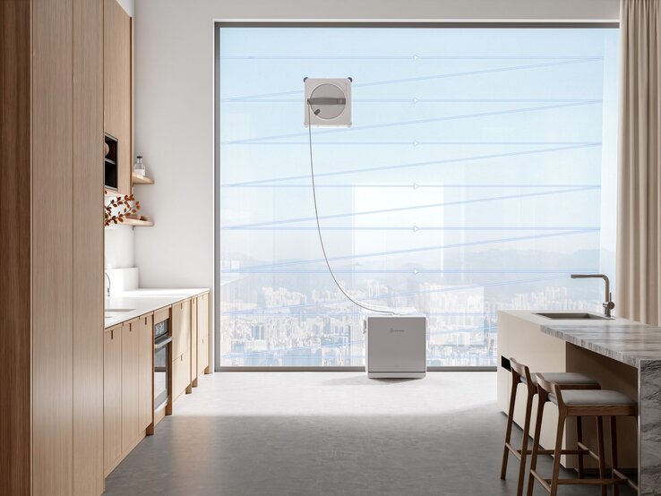  WINBOT W2S OMNI an einer Fensterscheibe im Einsatz. | © ECOVACS